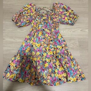 Boutique Floral Babydoll Dress with Lace-Up Back and Puff Sleeves